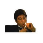 A sticker of Tony Montana from Scarface wearing a tuxedo and lighting a cigar.